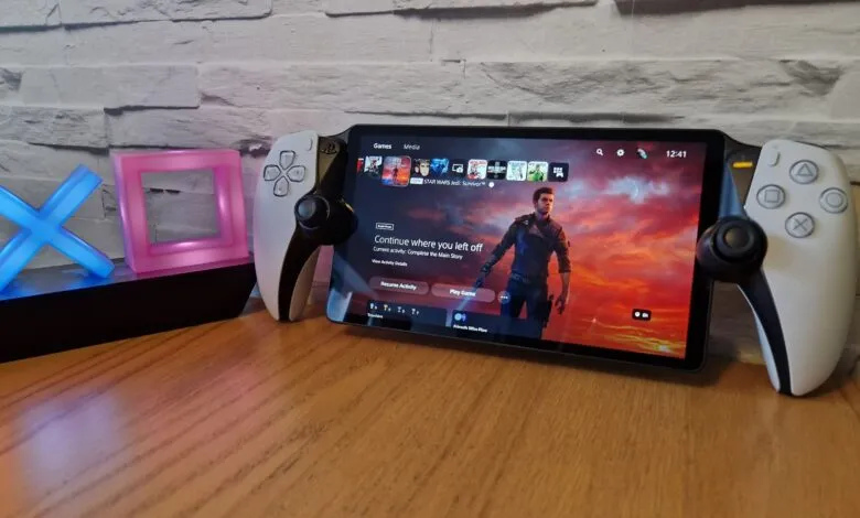 PlayStation 5 DualSense Edge controller attached to a tablet displaying the PS5 interface.