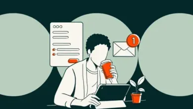 Person drinking coffee while working on a tablet with email notification.