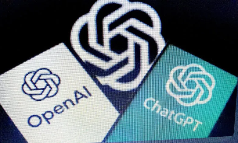 Close-up of the OpenAI and ChatGPT logos displayed on a screen.