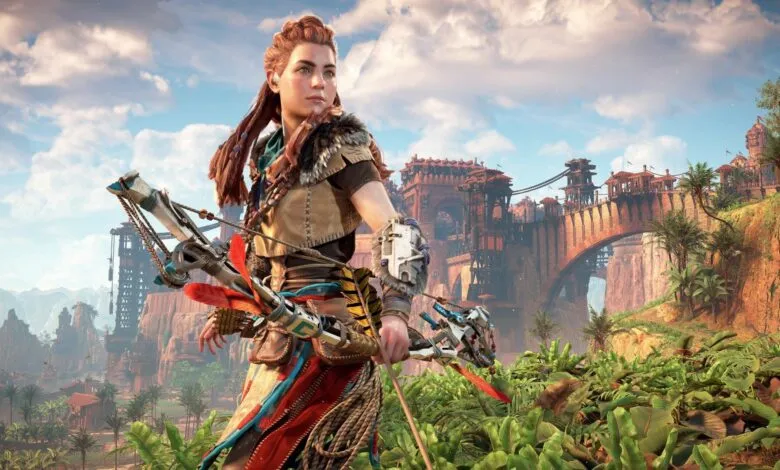 Aloy, protagonist of Horizon Forbidden West, holding a bow and arrow in a lush jungle setting.