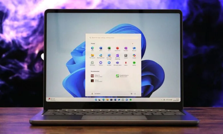 Laptop displaying the Windows 11 Start menu with various pinned and recommended apps.
