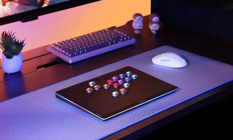 Gaming setup with a fight stick, keyboard, mouse, and RGB lighting.