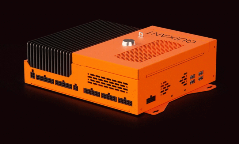 Orange industrial computer with black heatsink and multiple ports.