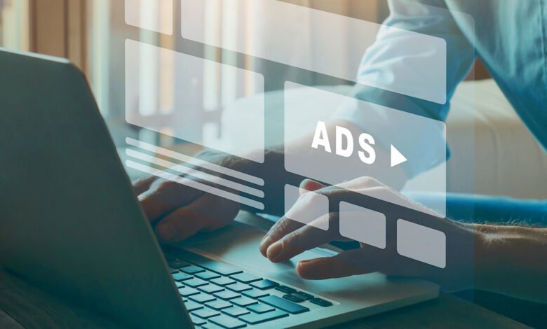 Person typing on a laptop with digital ad interfaces overlaid.