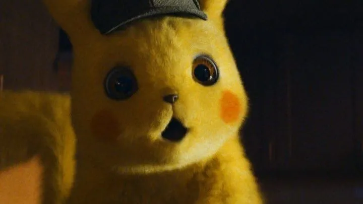 Detective Pikachu with a surprised expression, wearing a hat.