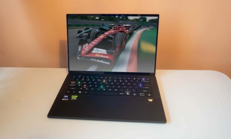 A sleek black laptop displaying a Formula 1 racing game on its screen.