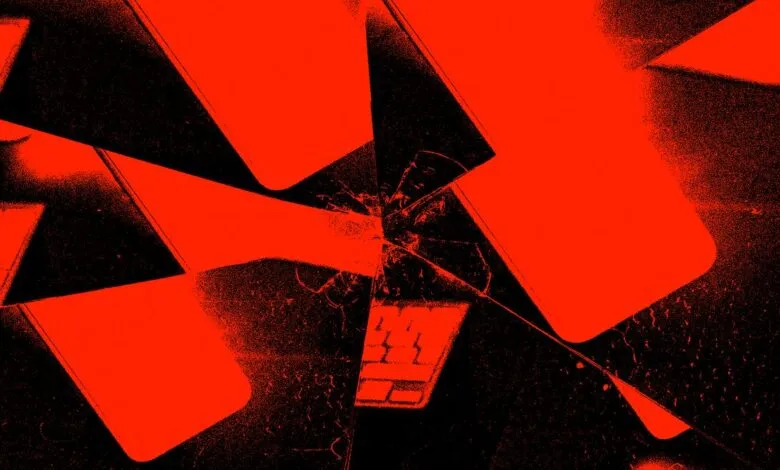 Abstract image of shattered laptop screens in vibrant red and black.