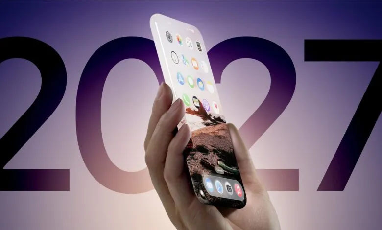 Hand holding a futuristic all-screen smartphone with a landscape wallpaper.