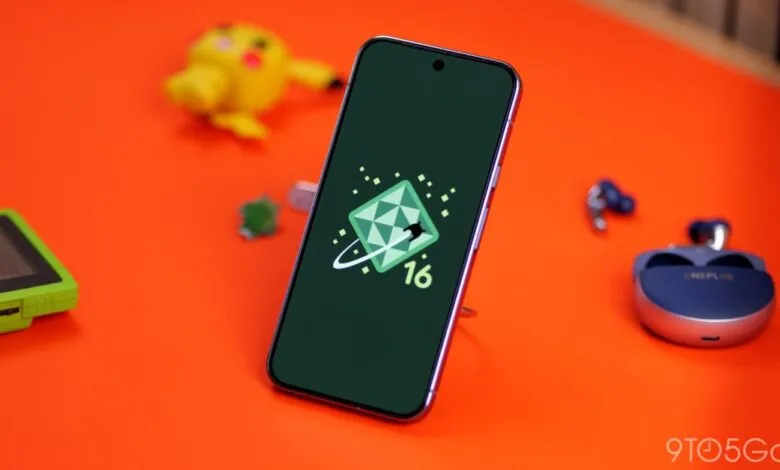 Smartphone displaying the Android 16 QPR1 logo with gaming accessories.