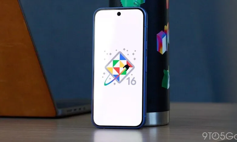 Smartphone displaying the Android 16 logo with a colorful geometric design.
