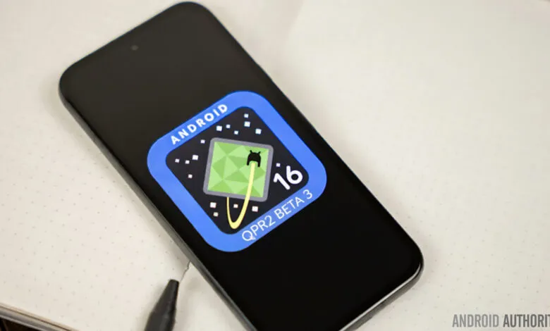 Smartphone displaying the Android 16 QPR2 Beta 3 logo with a stylized alien character.