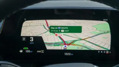 Close-up of a car's digital dashboard displaying navigation with a map and driving information.