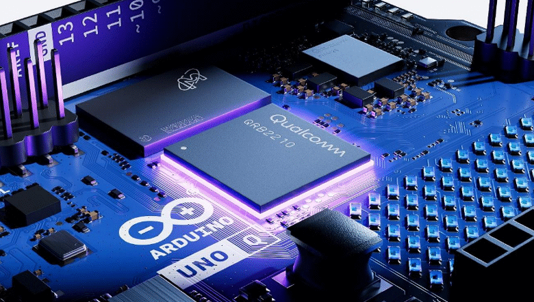 Close-up of an Arduino Uno circuit board with a glowing Qualcomm processor.