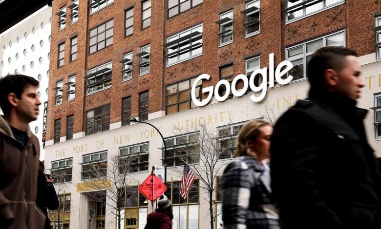 People walk past the Google building in New York City.