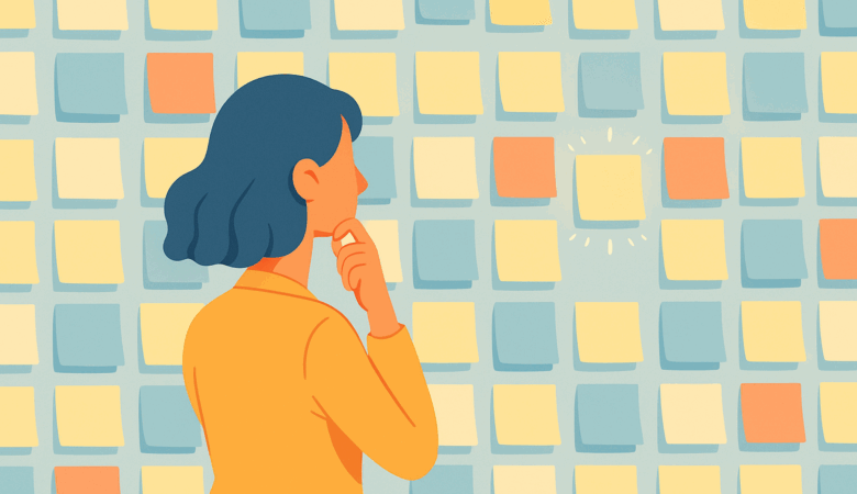 Woman in orange shirt looking at a wall of colorful sticky notes, one highlighted.