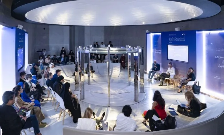 Audience seated in a modern, circular venue for the Dubai Future Forum.