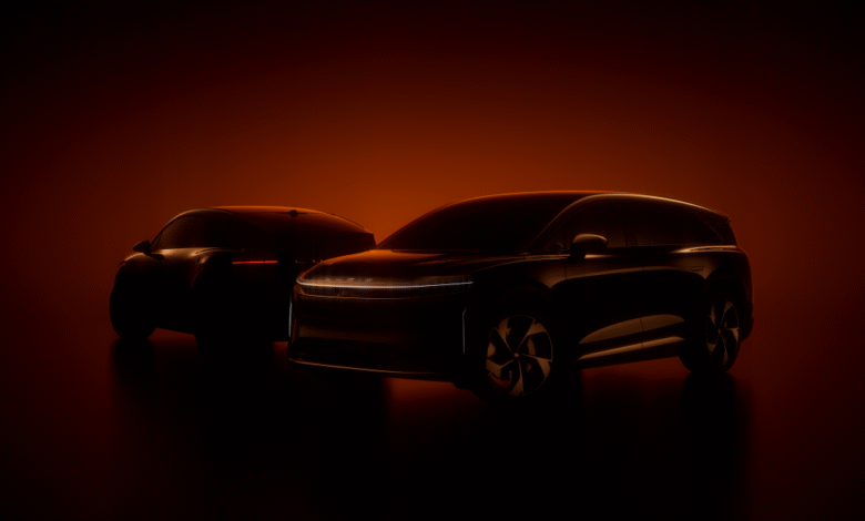 Two dark Lucid electric vehicles silhouetted against a warm orange background.