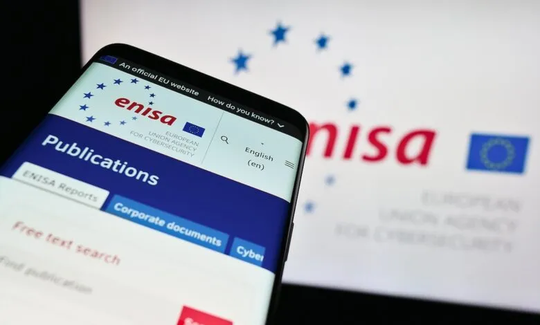 Smartphone displaying the ENISA website with EU stars and logo.