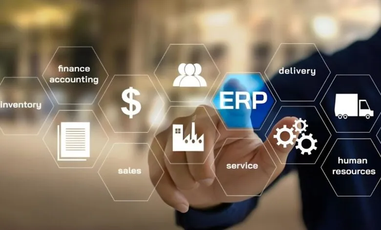 Hand touching a digital interface displaying ERP system modules like finance, inventory, and HR.