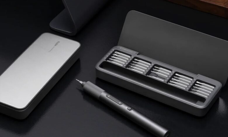 A sleek, modern electric screwdriver set with multiple bits in a gray case.
