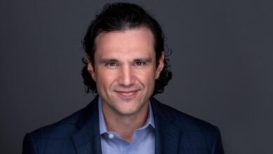 Ely Kahn, Vice President of Product Management at SentinelOne, smiles warmly.