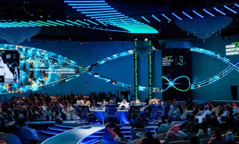 Audience watches a panel discussion at the Future Investment Initiative conference.