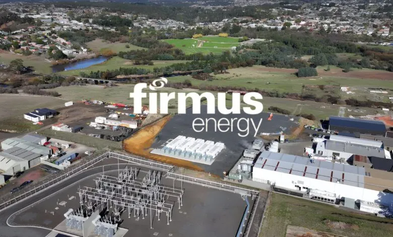 Aerial view of a large-scale energy facility with solar panels and electrical infrastructure.
