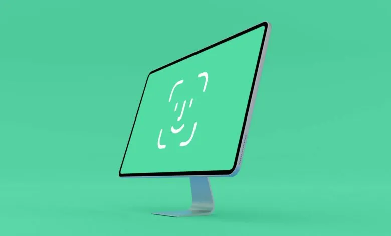 Modern iMac display showing a minimalist Face ID icon on a teal background.