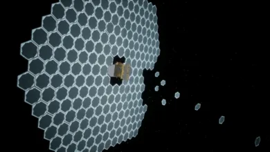 A spacecraft with large hexagonal solar panels in space, some panels are detached.