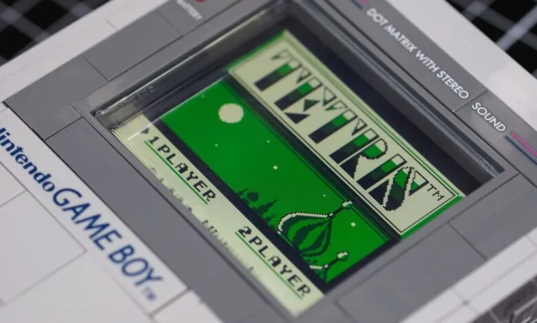 Close-up of a LEGO Nintendo Game Boy model displaying the Tetris game screen.