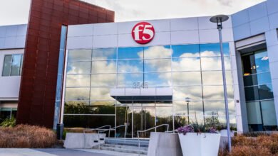 Modern F5 Networks corporate headquarters building with glass facade and red accent panels.