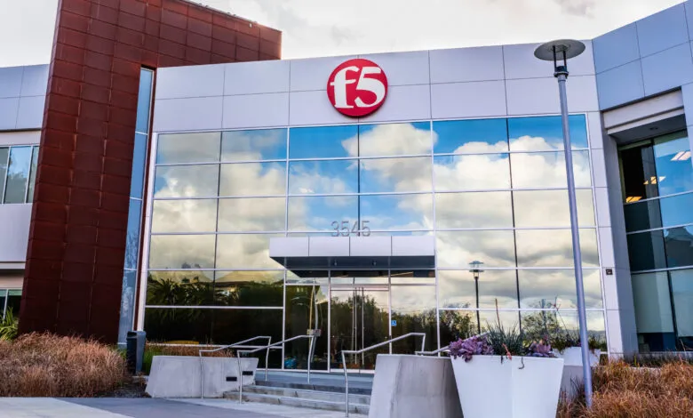 Modern F5 Networks corporate headquarters building with glass facade and red accent panels.
