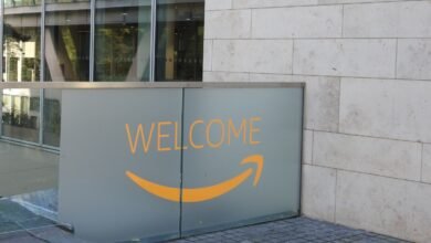 Frosted glass panel with orange text 'WELCOME' and Amazon smile logo.