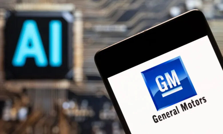 Smartphone displaying the General Motors logo next to an AI symbol.