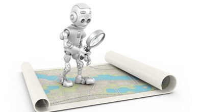 A small, white robot holding a magnifying glass over a rolled-out map.