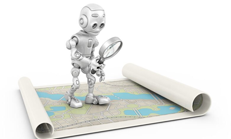 A small, white robot holding a magnifying glass over a rolled-out map.