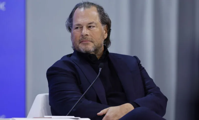 Marc Benioff, CEO of Salesforce, in a dark suit at a panel discussion.