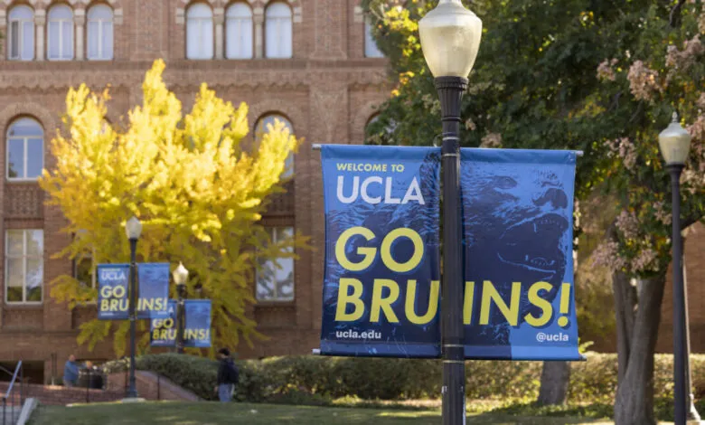 Welcome to UCLA banner with Go Bruins text and a bear graphic, set against a brick building and autumn foliage.