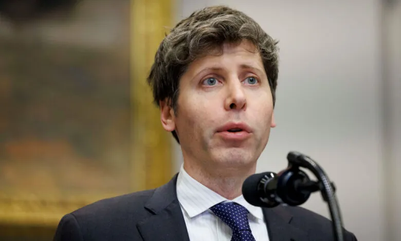 Sam Altman, CEO of OpenAI, speaks at a podium with a microphone.