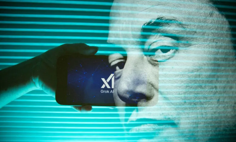 Elon Musk's face superimposed over a hand holding a smartphone displaying the Grok AI logo.