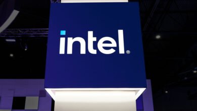The Intel logo is displayed prominently on a dark blue square sign.
