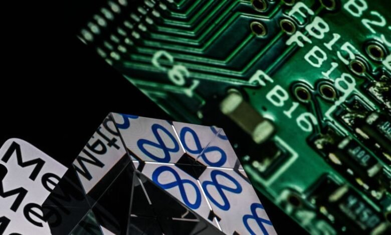 Close-up of a mirrored pyramid reflecting a circuit board and the word 'Meta'