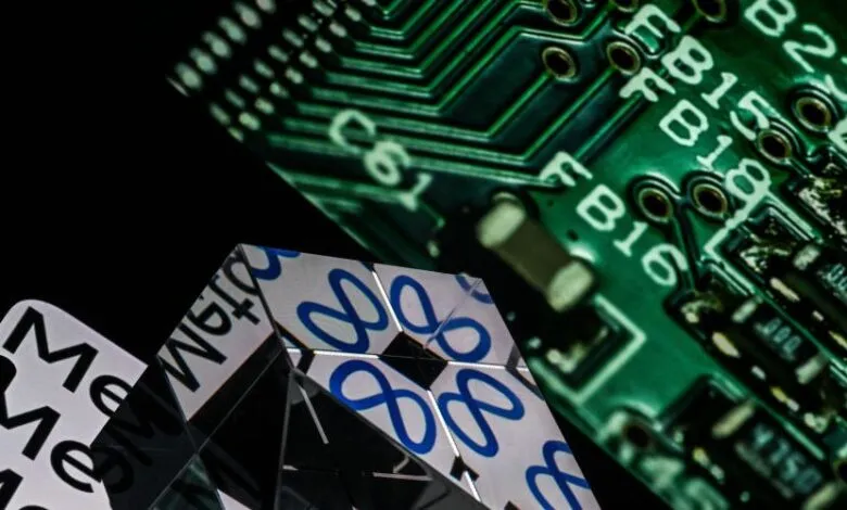Close-up of a mirrored pyramid reflecting a circuit board and the word 'Meta'