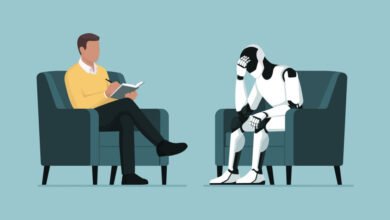 A psychologist sits in a chair, taking notes while a distressed robot sits opposite him.