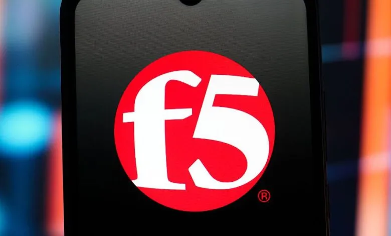 Close-up of the F5 Networks logo on a dark screen with a blurred background.
