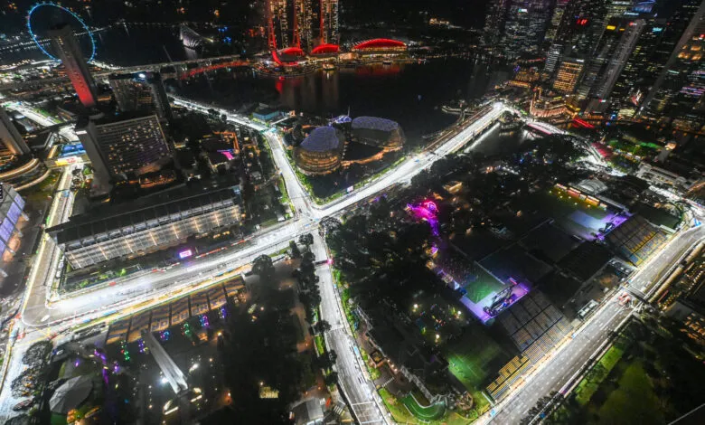Aerial view of the illuminated Singapore Grand Prix street circuit at night.