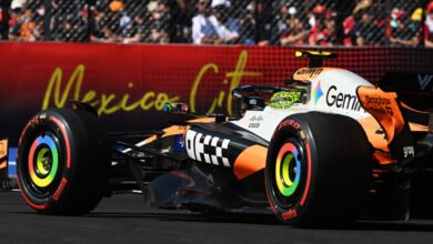 Lando Norris in a McLaren F1 car with rainbow wheel rims during the Mexico City Grand Prix.