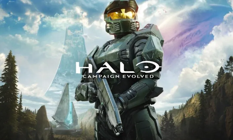 Master Chief in his iconic green armor stands ready with a rifle, overlooking a vast alien landscape.
