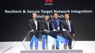 Four men in suits stand behind a display with the Huawei logo and text about network integration.