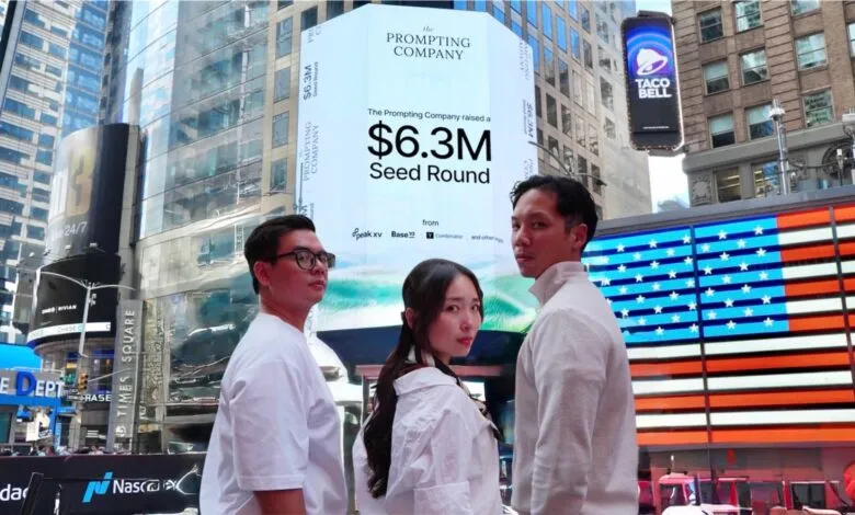 Three people stand in front of a large digital billboard announcing a $6.3M seed round for The Prompting Company.